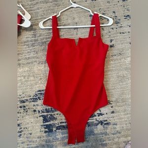 size m red body suit